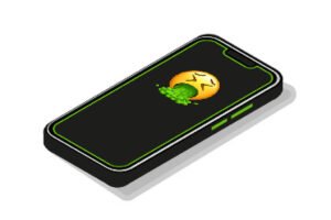 Um aparelho celular com um emoji de asco na tela.